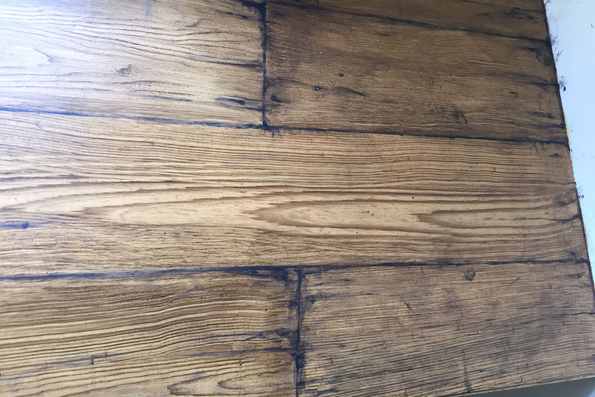 The creation of brick effects and wood graining bring interest and texture to otherwise regular spaces.  This wood panel is actually just a sheet of MDF!