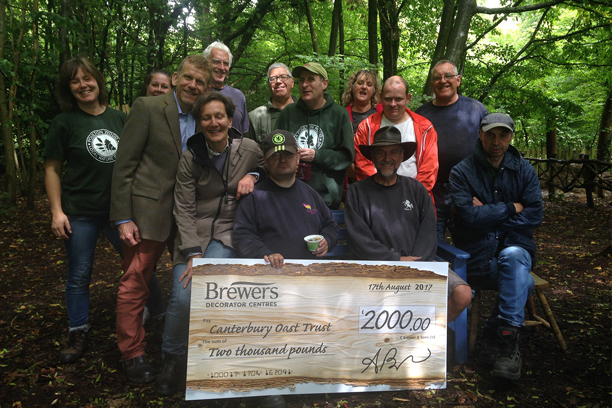Nick and Catherine Brewer presenting cheque of £2000 to Canterbury Oast Trust