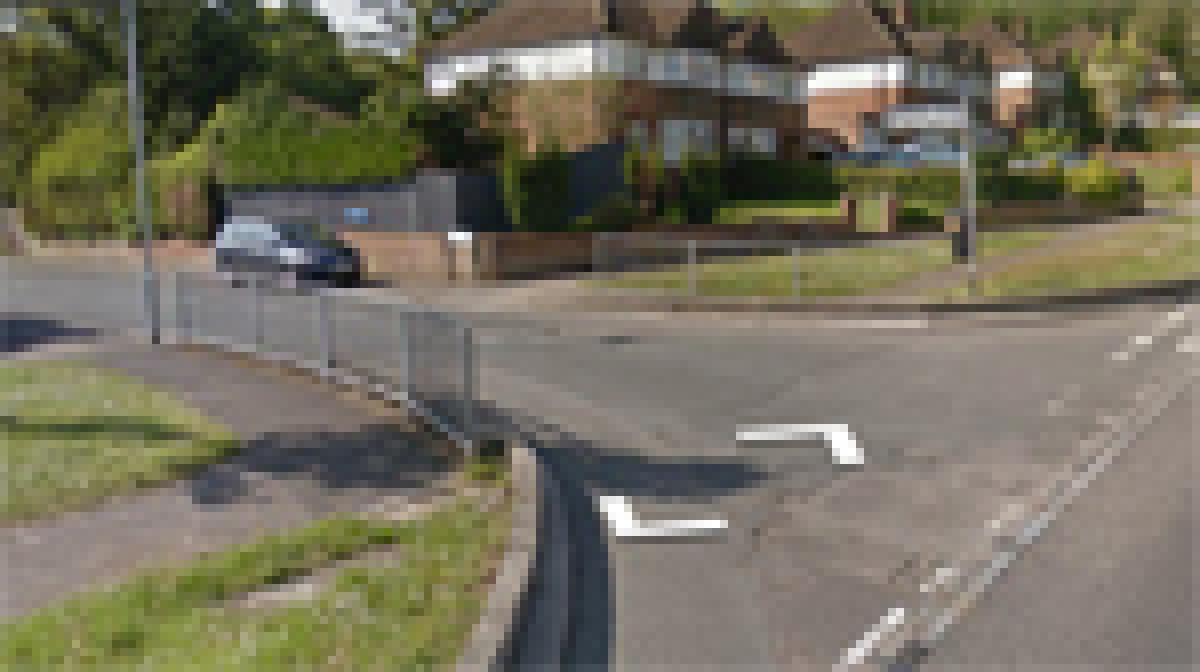 Take the second left onto Upton Road, following it down into the industrial estate.