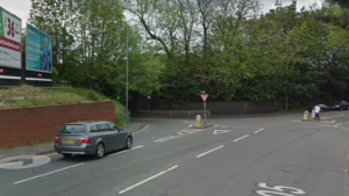Travelling South from the B4205 turn left under the railway bridge