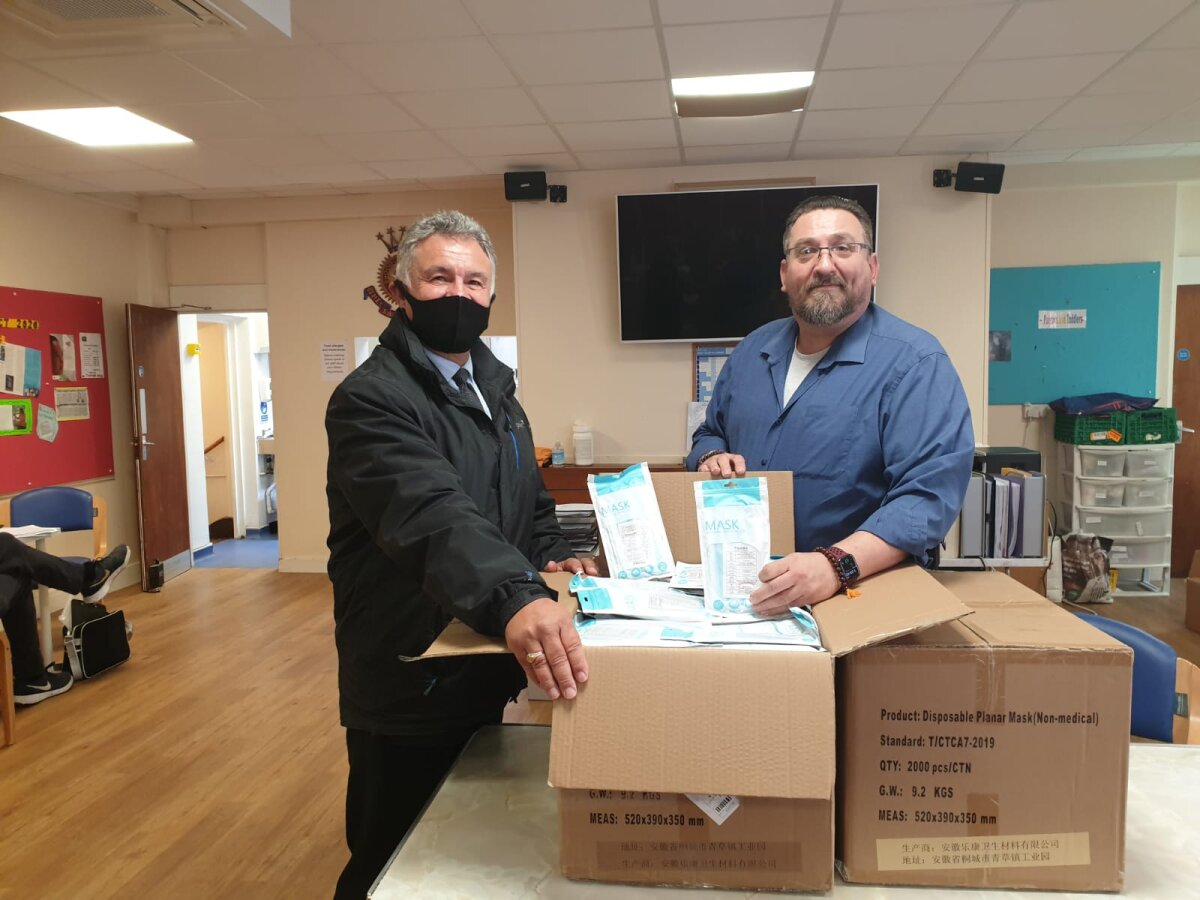Area Development Manager Tony handing delivering masks