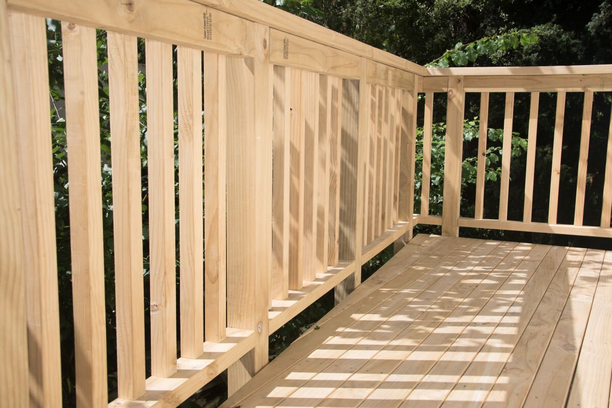 Protecting woodwork with varnish and preservatives.