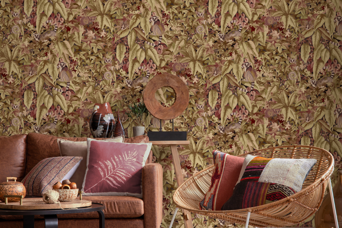 Pink and sage leaf wallpaper with sofa and chair in front