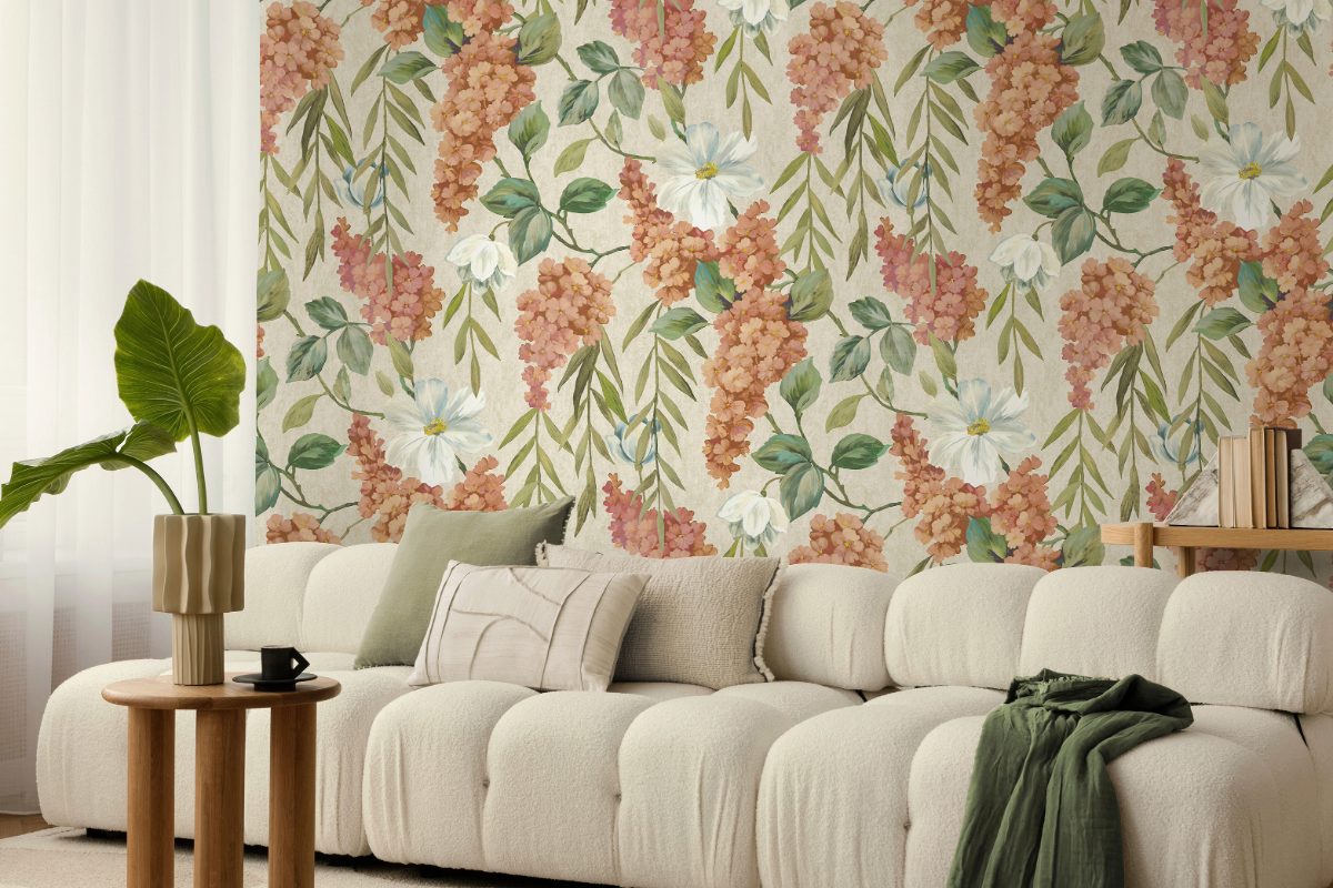 Orange and white draping flower wallpaper with cream sofa