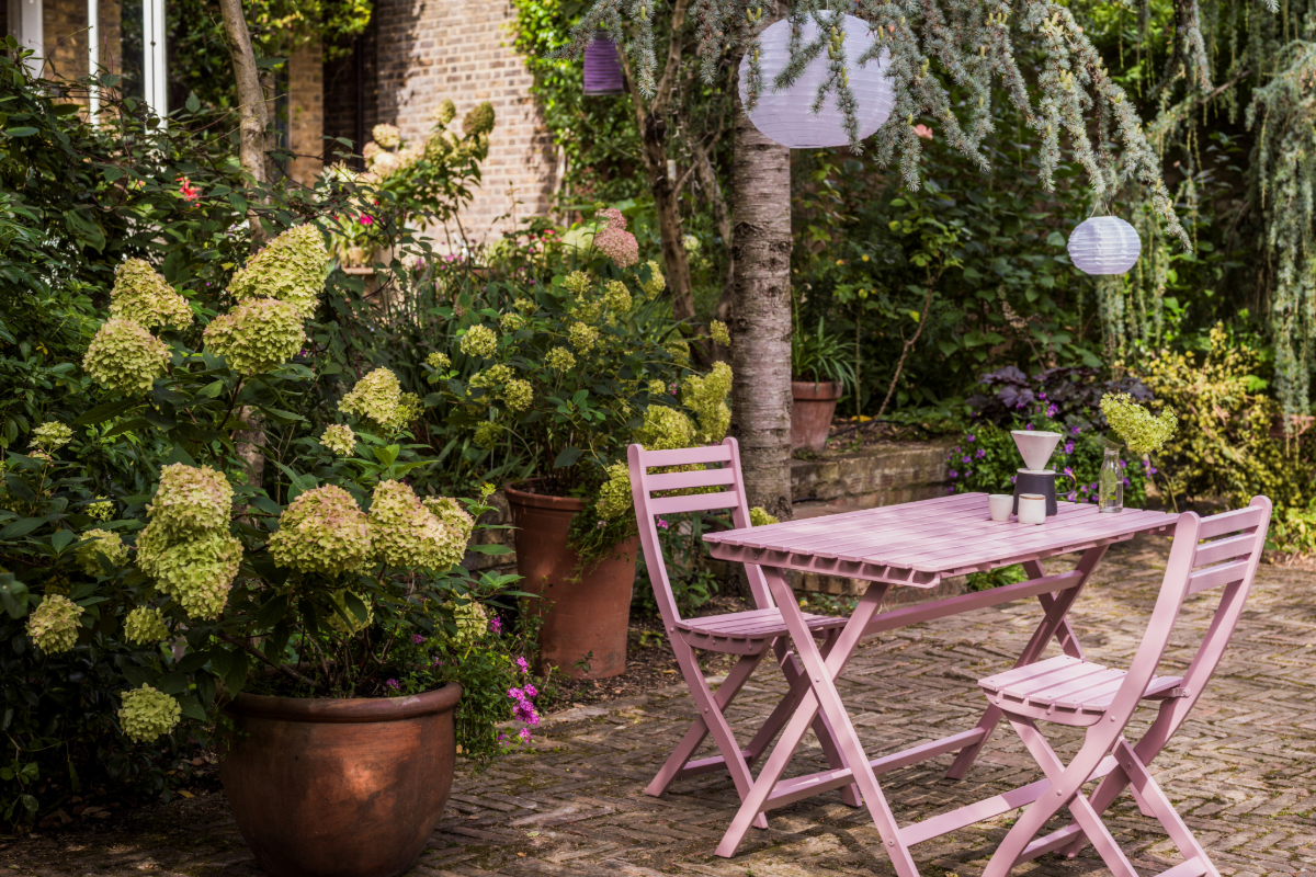 Pink table and chairs in a garden and patio area