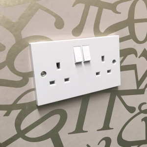 Take care when wallpapering around sockets.