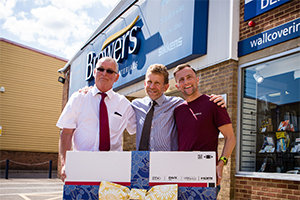 Competition winner Nathan Hobson receiving his 43" TV prize