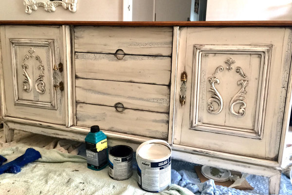 Extending to new canvases, furniture is also transformed by John’s brush work