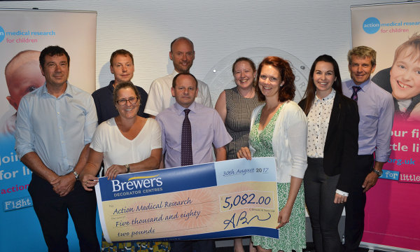 Brewers teams proudly present their fundraising efforts to Action Medical Research