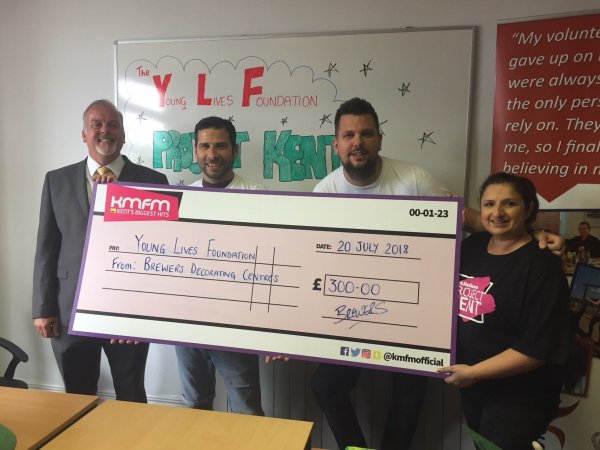 James Gillespie presenting £300 cheque to YLF