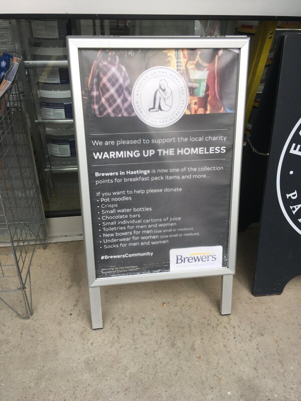 Warming up the Homeless poster outside Brewers Hastings store